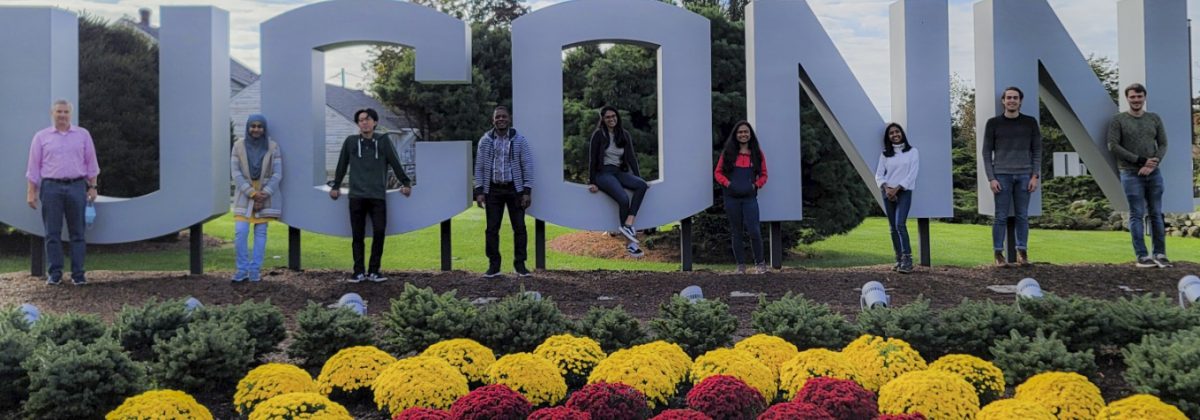 Group photo with UCONN sign